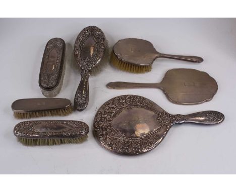 A George VI silver-clad brush set, with engine turned decoration, Birmingham 1947; together with a Victorian silver-clad brus