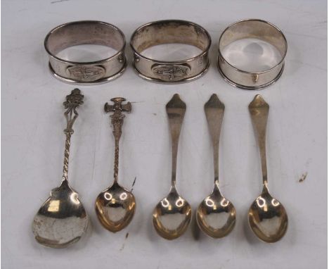 A set of three George VI silver tea spoons, Sheffield 1943, together with three silver napkin rings, and two further silver t