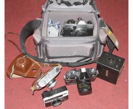 A collection of vintage photography equipment, to include a Praktica MTL5B SLR camera 