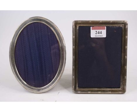 An Elizabeth II silver-clad easel photograph frame, Sheffield 2000, h.15cm; together with another of oval shape, h.16cm (2)