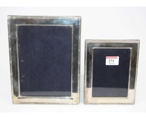 An Elizabeth II silver clad easel photo frame, height 22cm, Sheffield 2003, together with another smaller