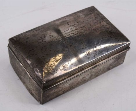 An early 20th century silver table cigarette box, of rectangular form, having hinged lid and cedar lined interior, the lid en