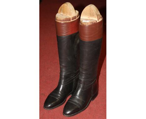 A pair of vintage leather riding boots and trees, probably size 9