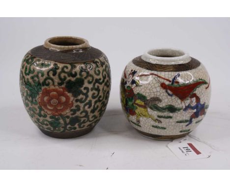 A Chinese ginger jar, enamel decorated with soldiers, height 10cm, together with another similar (2)Both intact.