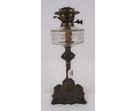 A Victorian brass oil lamp, having a faceted clear glass font, h.43cm 