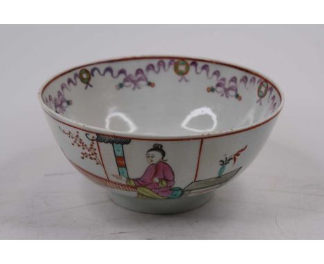 An 18th century Lowestoft porcelain slop bowl, polychrome enamel decorated with figures before a fence, dia. 15cm (a/f)