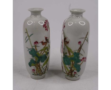 A pair of Chinese porcelain vases, each enamel decorated with birds amongst flowers, height 14cmModern – condition is good.