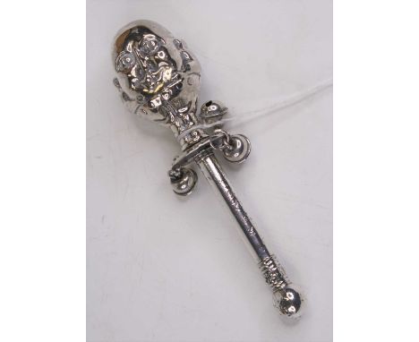 A Victorian style white metal baby's rattle, the finial in the form of a two faced head, inscribed Victoria Hayes born 3rd Ju