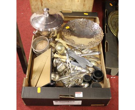 A box of silver plated items to include a pierced bonbon dish, trophy cups and flatware