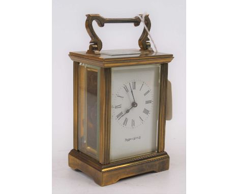 A Mappin &amp; Webb brass cased carriage clock, the enamel dial showing Roman numerals, having visible platform escapement, h