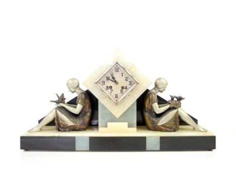 Art Deco clock inscribed Feunteun Brest, flanked either side by a spelter girl holding birds, on black and white marbleProven