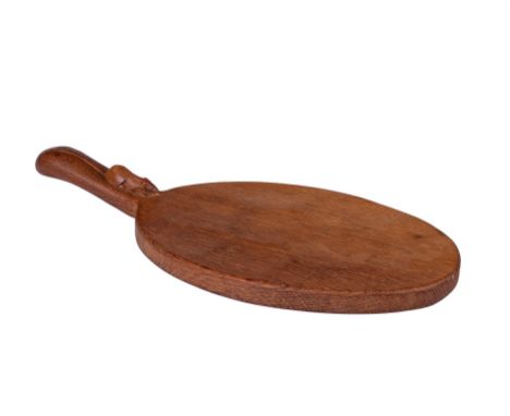 Robert 'Mouseman' Thompson of Kilburn, oval cheeseboard with carved mouse signature to the handle, 37cm x 18cm. Provenance: v