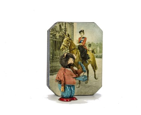A Clockwork Tinplate Bear and Tin Box, Japanese made Bear with furry face and ears, hand raises an answering phone with ringi