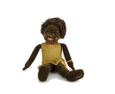 A Norah Wellings Black Doll, in dark brown with painted face, plastic orange earrings and one bracelet and necklace, light br