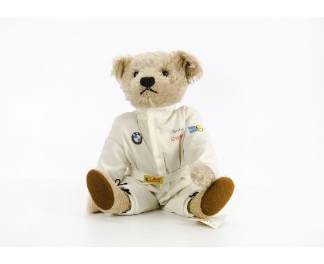 A Steiff 'Racing Driver' Teddy Bear, in beige mohair with Racing  overalls and BMW, Castrol, Bosch and Volvo Logos, with tag,