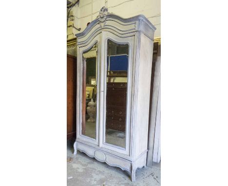 ARMOIRE, 19th century French light blue painted with scrolling surmount above a pair of doors with shaped bevelled mirror pan