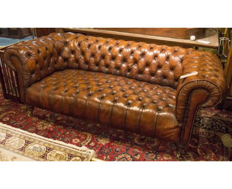 CHESTERFIELD SOFA, Victorian style deep button and brass studded hand finished leather with curved back and arms, 205cm W.