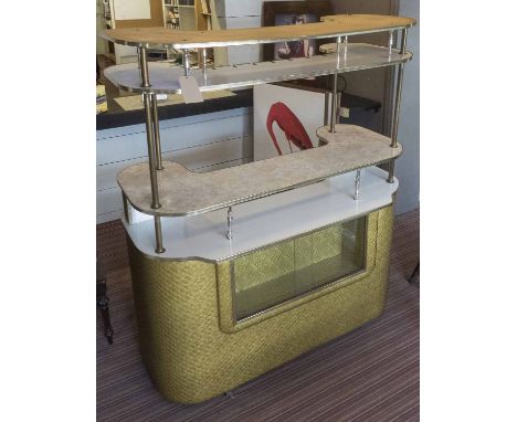 BAR, mid 20th century brass and melamine with open raised shelves, interior light and stitched padded front, 150cm x 170cm H 