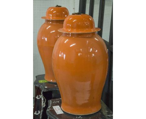 VASES, a pair, Chinese orange glazed ceramic with covers, 51cm W (2)