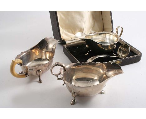 A SMALL 20TH CENTURY SAUCE BOAT with an ivory handle by E. Viner, Sheffield 1938, another sauce boat with matching ladle (in 