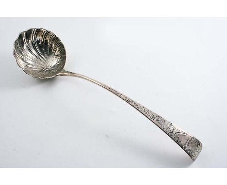 AN EARLY GEORGE III IRISH SOUP LADLE with a chased & fluted circular bowl and chased decoration up the stem, crested, by Alex