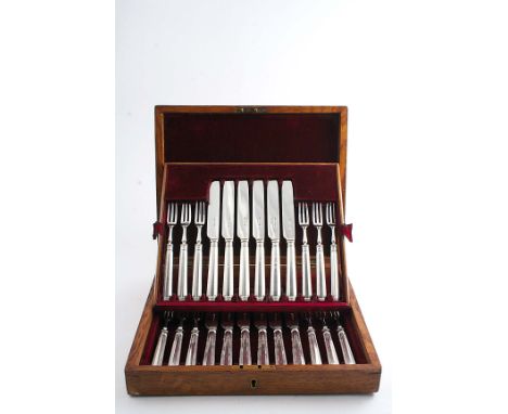 AN EDWARDIAN CASED SET OF TWELVE PAIRS OF FRUIT/DESSERT KNIVES & FORKS with loaded handles, by Harrison Brothers & Howson, Sh