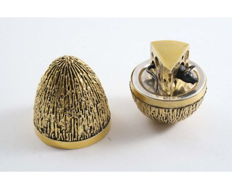 A CONTEMPORARY SILVERGILT SURPRISE EGG with a textured finish, the interior with a mouse poking out of a cheese wedge, by Ste
