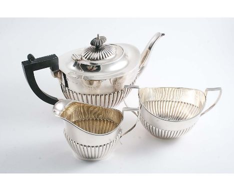 A MID 20TH CENTURY OVAL TEA POT with part-fluted decoration, by the Barker Brothers Silver Ltd., Birmingham 1947 and a slight