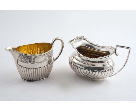 A LATE VICTORIAN PART-FLUTED OVAL CREAM JUG with a bright-engraved frieze below the rim, gilt interior, by Walter & John Barn