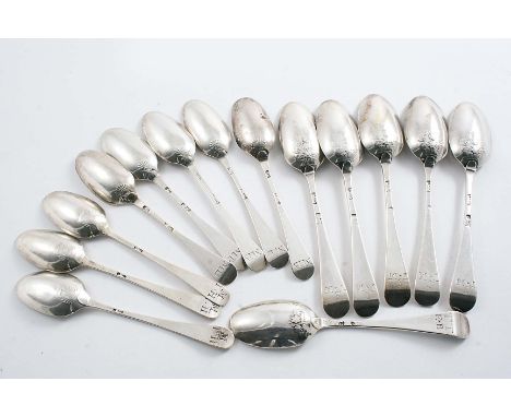 A SET OF FIVE GEORGE III PICTURE-BACK TEA SPOONS scratched "S" over "TM", with a basket of flowers below the drop, by Henry B
