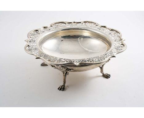 AN EARLY 20TH CENTURY FRUIT DISH on four paw feet wit a shaped & pierced border, by H. Wilkinson of Sheffield 1914;  10.3"  (