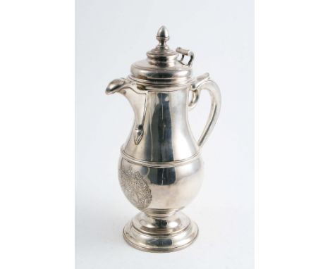 A GEORGE I IRISH FLAGON  of baluster form on a domed circular foot, with an applied moulded girdle & a harp-shaped handle, th