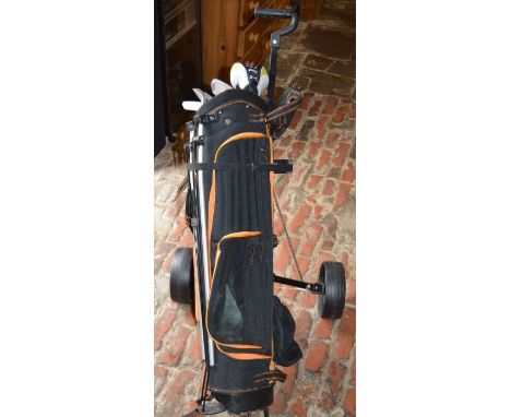 Junior left handed set of golf clubs in a caddy