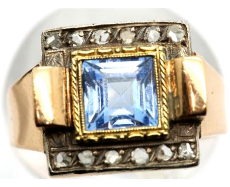 Georgian presumed 15ct rose gold dress ring, set with a large square cut aquamarine, flanked by two rows of old cut diamonds,