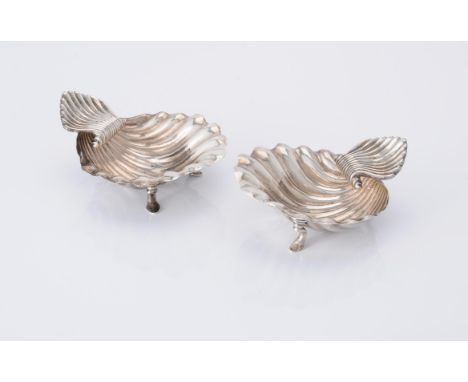 
	
		A pair of George III silver shell shaped butter dishes by William Abdy II, London 1792, with shell shaped thumb pieces a