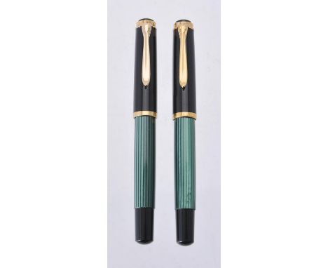 
	
		Pelikan, Souveran, M400, two green and black roller ball pens, the black caps with gilt clips and cap bands
		
		Conditi