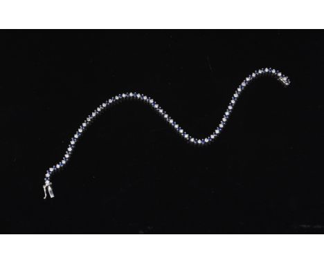 
	
		A sapphire and diamond line bracelet, alternately set along the length with circular cut sapphires and brilliant cut dia