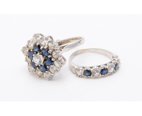 
	
		A sapphire and white stone target cluster ring, the circular cut sapphires and white stones in a white gold coloured set