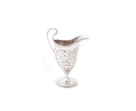 
	
		A George III silver helmet shaped cream jug, maker's mark obscured, London 1782, with a beaded border, high clip handle,