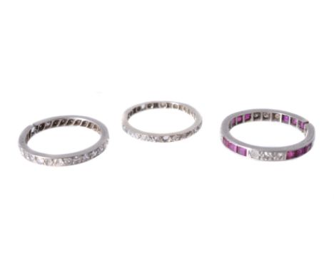 
	
		Three eternity rings, the first set with eight cut diamonds, approximately 0.72 carats total, finger size N 1/2; a step 