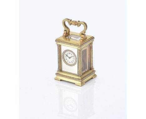 
	
		A brass and seed pearl miniature carriage clock, no. 2214, silvered dial, Arabic numerals, blued steel hands, loop handl