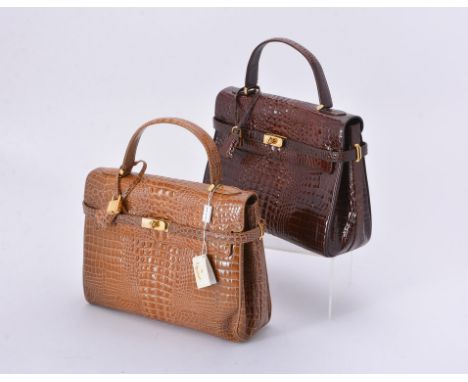 
	
		Y&nbsp;De Nicola, Roma, a dark brown alligator handbag, with a loop handle, a twist lock clasp, the flap opening to a br
