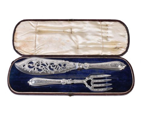 
	
		A pair of Victorian silver fish servers by John Gilbert, Birmingham 1859 and 1860, pierced and scroll engraved, each wit
