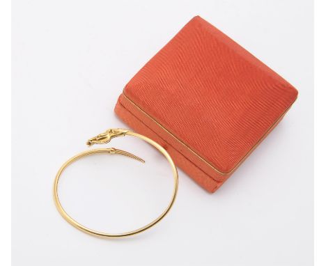 
	
		An 18 carat gold horse bangle, the polished bangle with a horse head terminal, with London import mark, 9.2g
		
		Condit