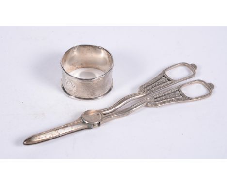 
	
		An Edwardian pair of silver grape scissors by George Unite, Birmingham 1907, with loop handles, 18cm (7in) long; and an 