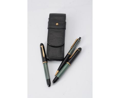 
	
		Pelikan, 140, two black and green fountain pens, the caps with gilt clips and cap bands, one medium nib and a DFF nib, b