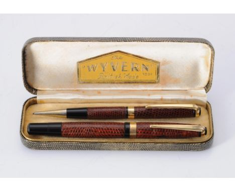 
	
		Y&nbsp;Wyvern, a lizard skin wrapped fountain pen and propelling pencil, the fountain pen cap with gilt clip and cap ban
