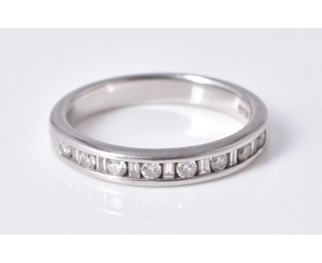 
	
		A diamond half eternity ring, set with brilliant and baguette cut diamonds, approximately 0.23 carats total, mounted in 