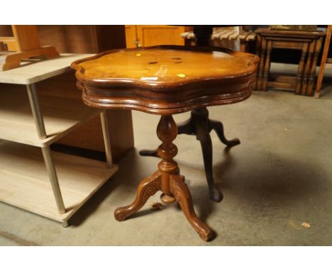 An Italian style inlaid occasional table raised on tripod base