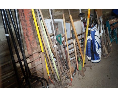 A quantity of long handled garden tools